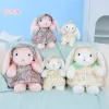 A genuine forest-themed floral dress with droopy ears, a plush rabbit doll, a floral dress, and a cute little rabbit figurine for home decoration details Picture